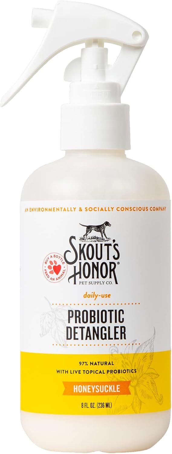 Applying Skout's Honor dog conditioner to a golden retriever coat