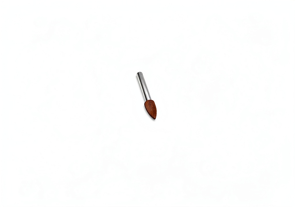Shofu Dental polishing points with FG shank in use on a metal surface