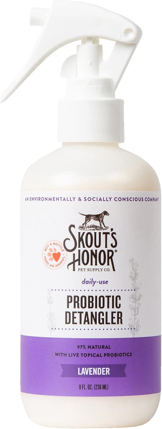 Dog being sprayed with Skout's Honor conditioner