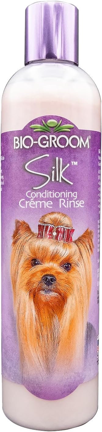 Pet owner bathing a puppy with Bio-Groom Tearless Shampoo